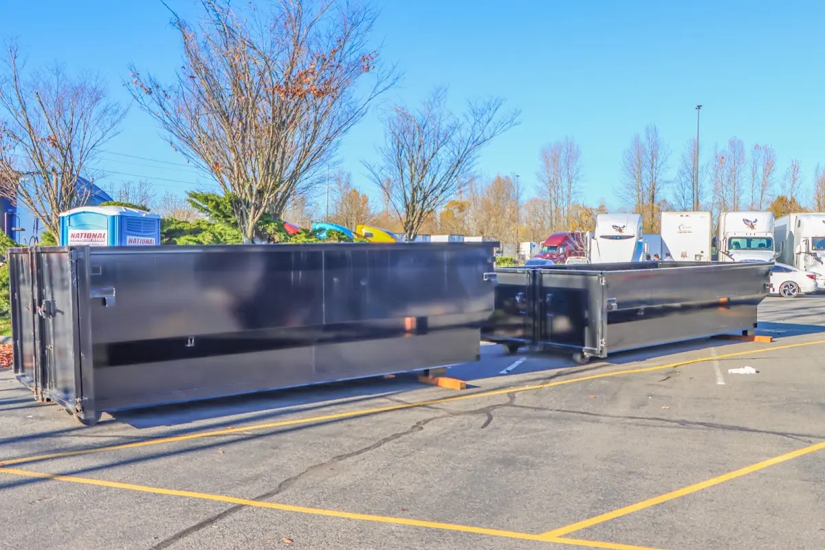 Professional dumpster rental service with roll-off container on residential driveway in Lake Wisconsin